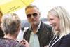 Eddie irvine greets belfast city council ceo suzanne wylie and councillor mairead o'donnell