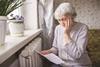 Worried old lady with gas bill shutterstock_1347745217 Solarisys PW250322