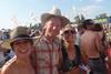 Hats off: the Lintons enjoy the scorching Glastonbury sun thanks to an unnamed van provider