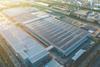 Warehouse roof with solar panels shutterstock_2274085107 GreenOak