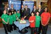 Bat man returns: British Land chief Chris Grigg (centre) cuts the charity’s birthday cake at the launch of the 2010 Kids Cricket League