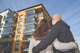 Younf couple loking at new flats shutterstock_75568579 Mika Heittola