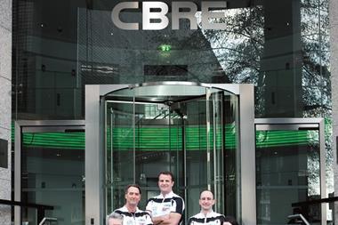 4 cyclists outside CBRE building