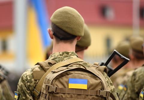 Ukrainian soldier backpack shutterstock_2029547321 Bumble Dee
