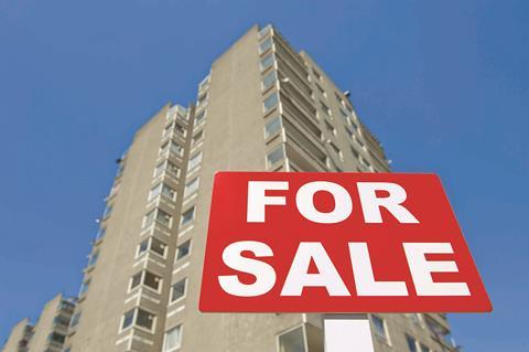 Block of flats with for sale sign shutterstock_376641301 John Gomez