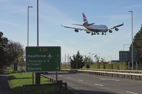 Heathrow sign and plane